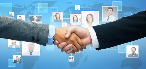 Image showing businessman and businesswoman shaking hands