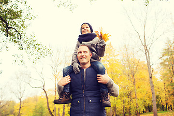 Image showing happy family having fun in autumn park