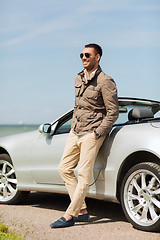 Image showing happy man near cabriolet car outdoors