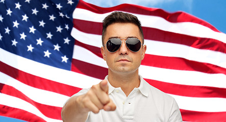 Image showing man pointing on you over american flag background