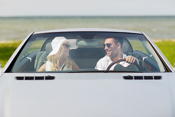 Image showing happy man and woman driving in cabriolet car