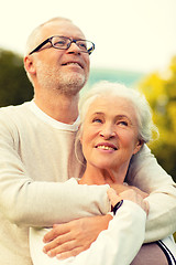 Image showing senior couple hugging in park