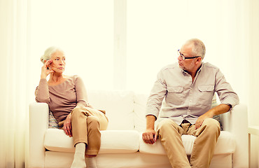 Image showing senior couple sitting on sofa at home