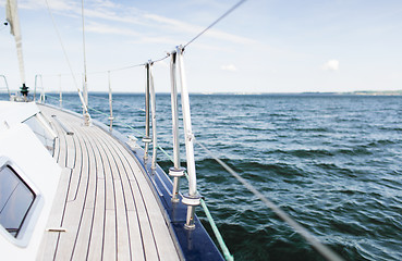 Image showing close up of sailboat or sailing yacht deck and sea