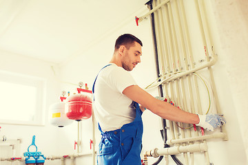 Image showing builder or plumber working indoors