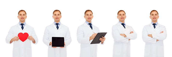 Image showing doctors with red heart, tablet pc and clipboard