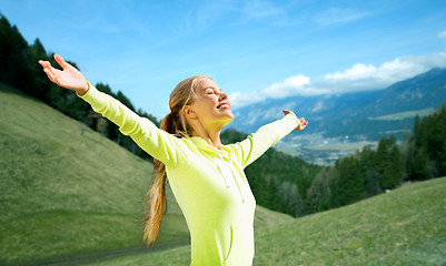 Image showing happy woman in sportswear enjoying sun and freedom