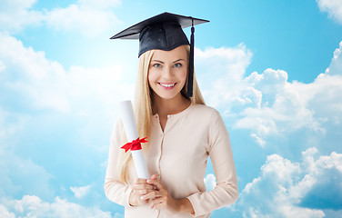 Image showing happy student girl in bachelor cap with diploma