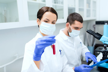 Image showing young scientists making test or research in lab