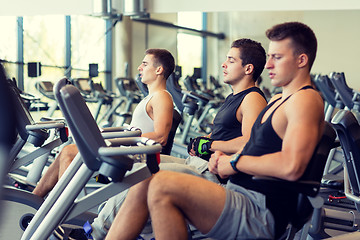 Image showing men working out on exercise bike in gym