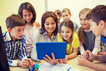 Image showing group of kids with teacher and tablet pc at school