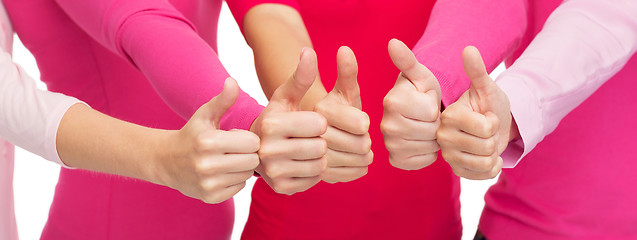 Image showing close up of women in pink shirts showing thumbs up