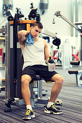 Image showing man exercising on gym machine