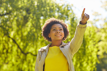 Image showing happy african american young woman in summer park