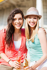 Image showing girls with drinks on the beach