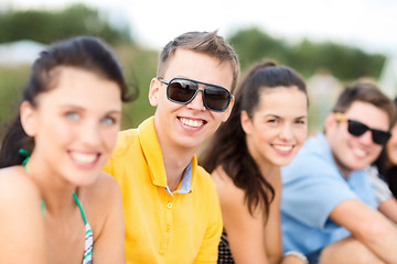 Image showing group of happy friends on beach