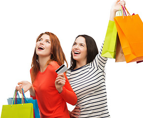 Image showing teenage girls with shopping bags and credit card