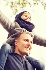 Image showing happy family having fun in autumn park