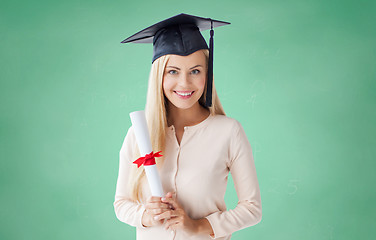 Image showing happy student girl in bachelor cap with diploma