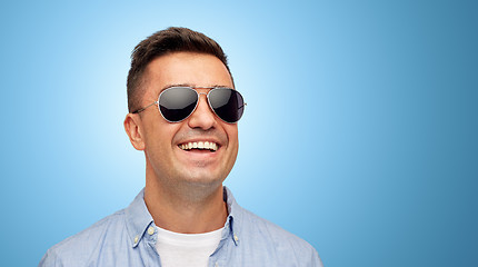 Image showing face of smiling man in shirt and sunglasses