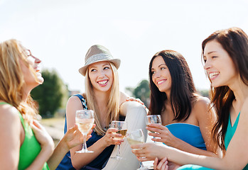 Image showing girls with champagne glasses on boat