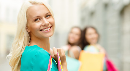 Image showing beautiful woman with shopping bags in the ctiy