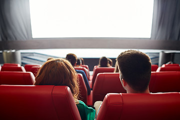 Image showing happy couple watching movie in theater or cinema