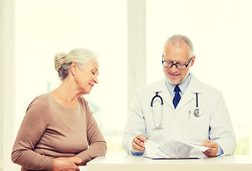 Image showing smiling senior woman and doctor meeting