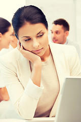 Image showing businesswoman with laptop computer at work