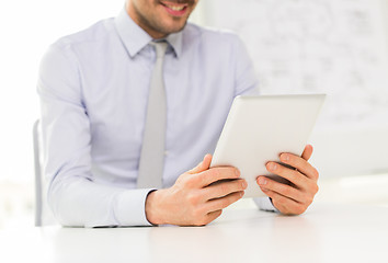 Image showing close up of businessman hands with tablet pc