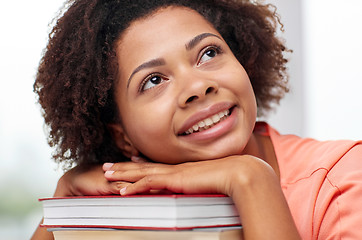 Image showing happy african student girl with books at home