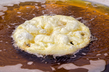 Image showing Frying cake dough