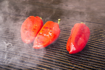 Image showing Grilling red peppers