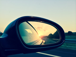 Image showing Sunset in a rear view mirror