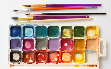 Image showing Box of paints and paint brushes