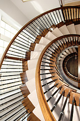 Image showing Closeup of a round staircase over three floor\'s