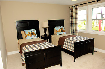 Image showing Bedroom with two single beds and windows.