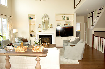 Image showing Living room with fireplace and stairs.