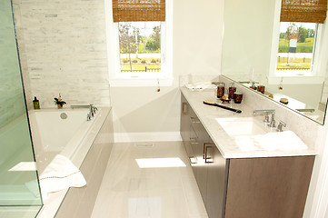 Image showing Bright bathroom in a new house with bath stab.