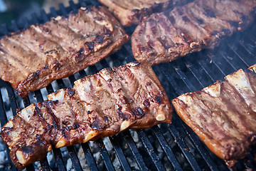 Image showing Grilled pork ribs on the grill.