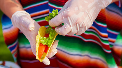 Image showing Chef making tacos at a street cafe
