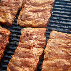 Image showing Grilled pork ribs on the grill.