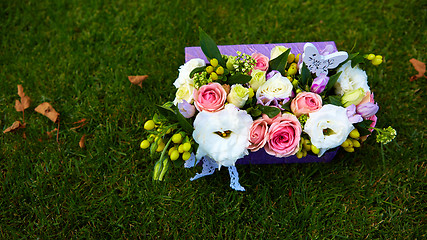 Image showing Beautiful flowers in a basket