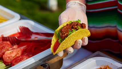 Image showing Chef making tacos at a street cafe