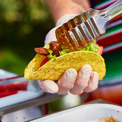 Image showing Chef making tacos at a street cafe