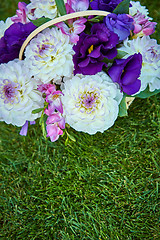 Image showing Beautiful flowers in a basket