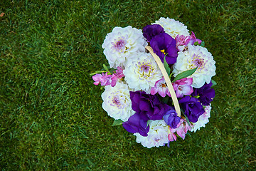 Image showing Beautiful flowers in a basket