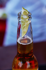 Image showing ice cold beer in a bottle with wedge lime