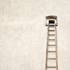 Image showing wall with a small window and wooden ladder