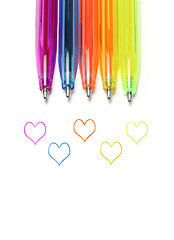 Image showing Bright colorful pens and abstract hearts